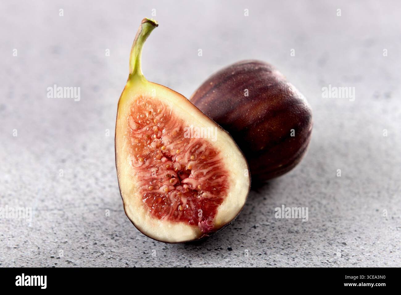 Fresh figs fruit on a gray background. Close up Stock Photo