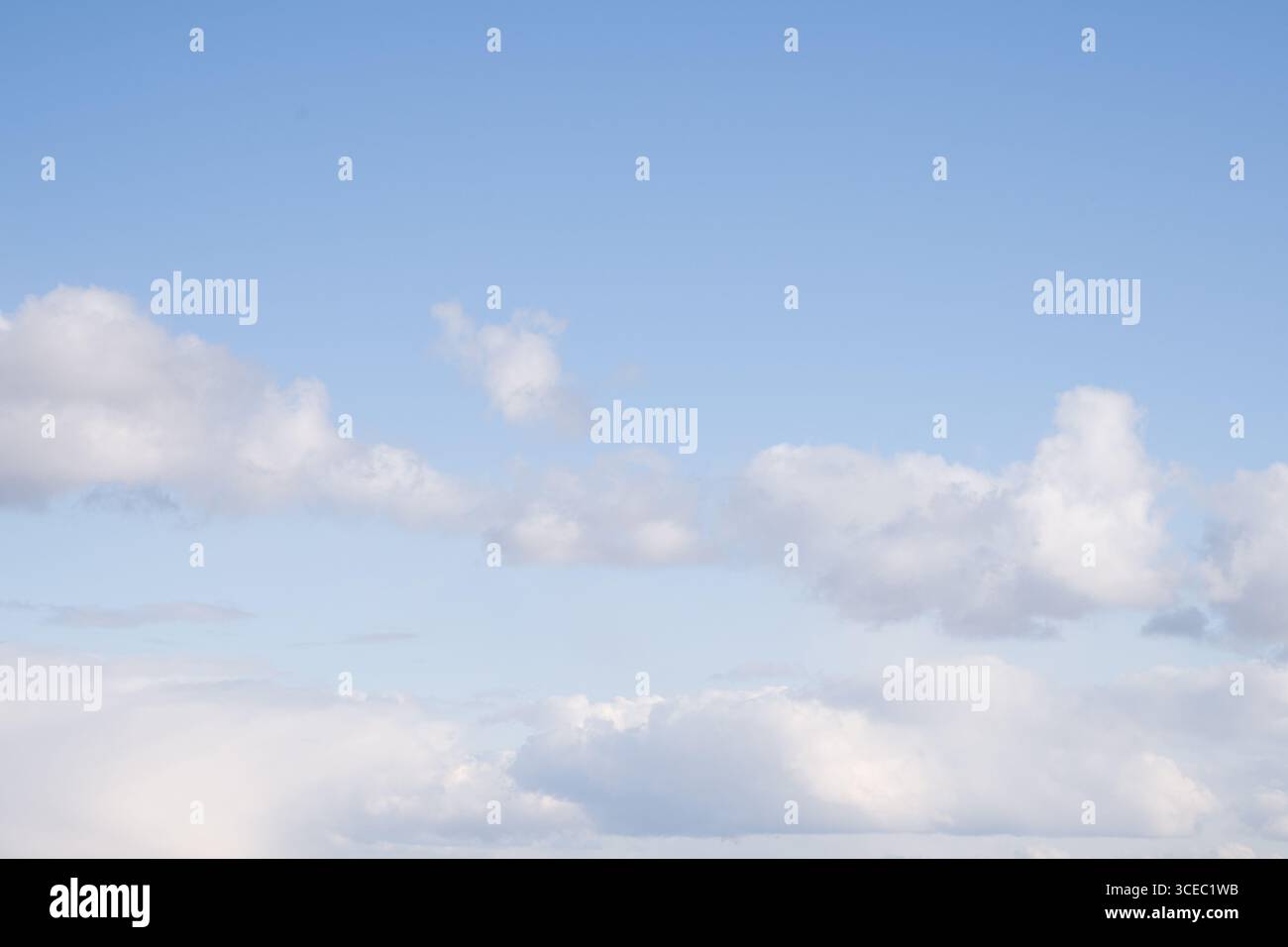Blue Sky with Scattered White Clouds Stock Photo