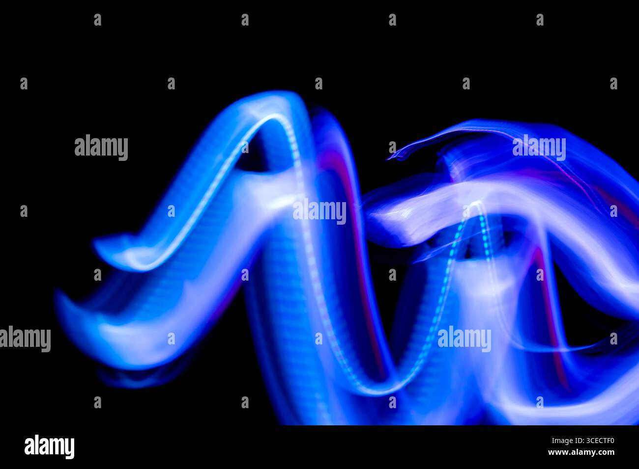 Blue purple light trails swirling hi-res stock photography and images ...