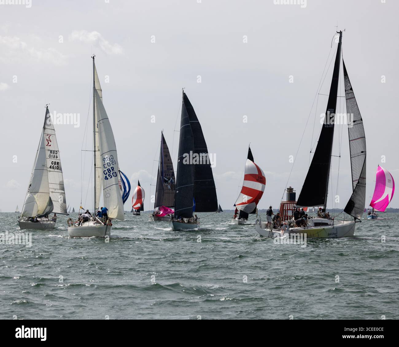 Sunfast 3600 Class yacht GBR8258R 'Solis Ortus' leads a group of other yachts round the leeward mark during Cowes Week 2025 Stock Photo