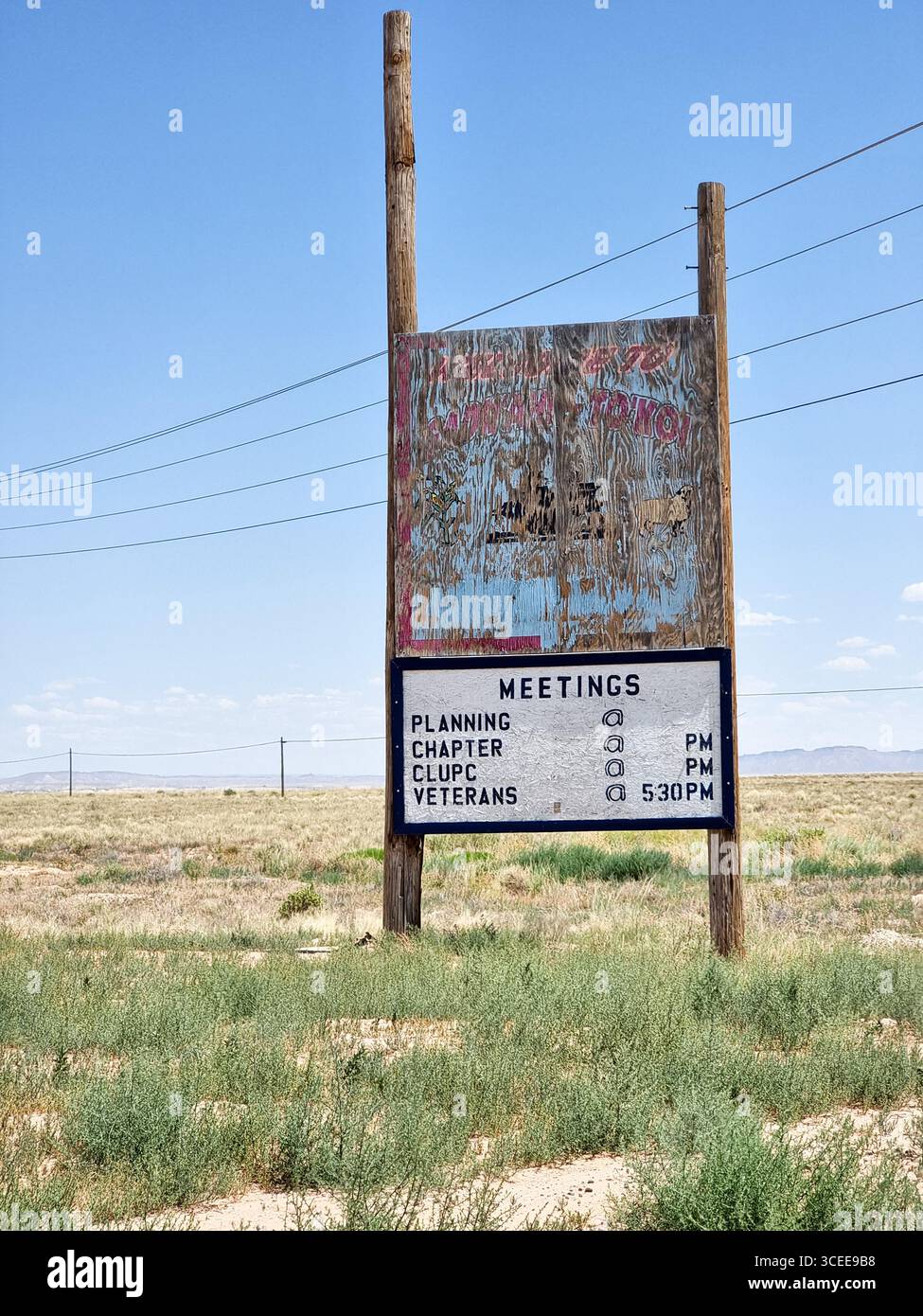 Old weathered wooden sign / message board in the prairie of New Mexico, U.S.A. to show planning, chapter, CLUPC and veterans meetings; community board - Smartphone Captured Stock Image