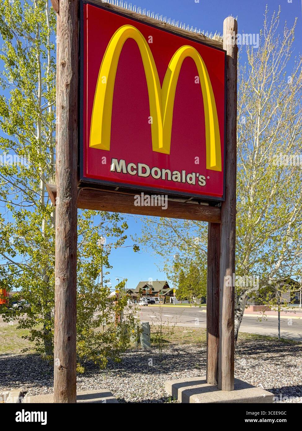 West Yellowstone, Montana, USA - 30 May 2025: Sign outside the branch of McDonald's in the small town of West Yellowstone - Smartphone Captured Stock Image West Yellowstone, Montana, USA - 30 May 2025: Sign outside the branch of McDonald's in the small town of West Yellowstone - Smartphone Captured Stock Image