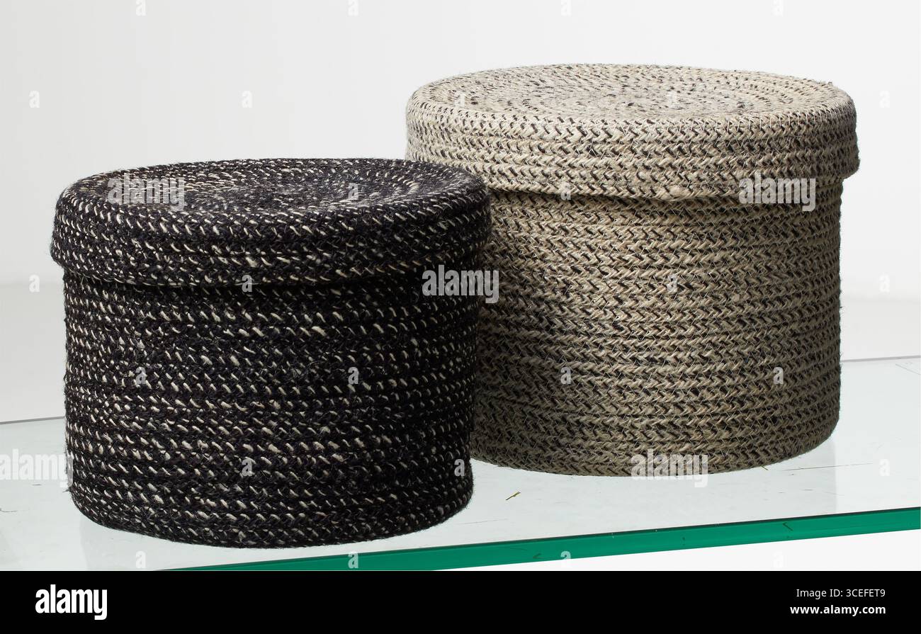 Two round woven laundry baskets solated nature background with clipping path Stock Photo