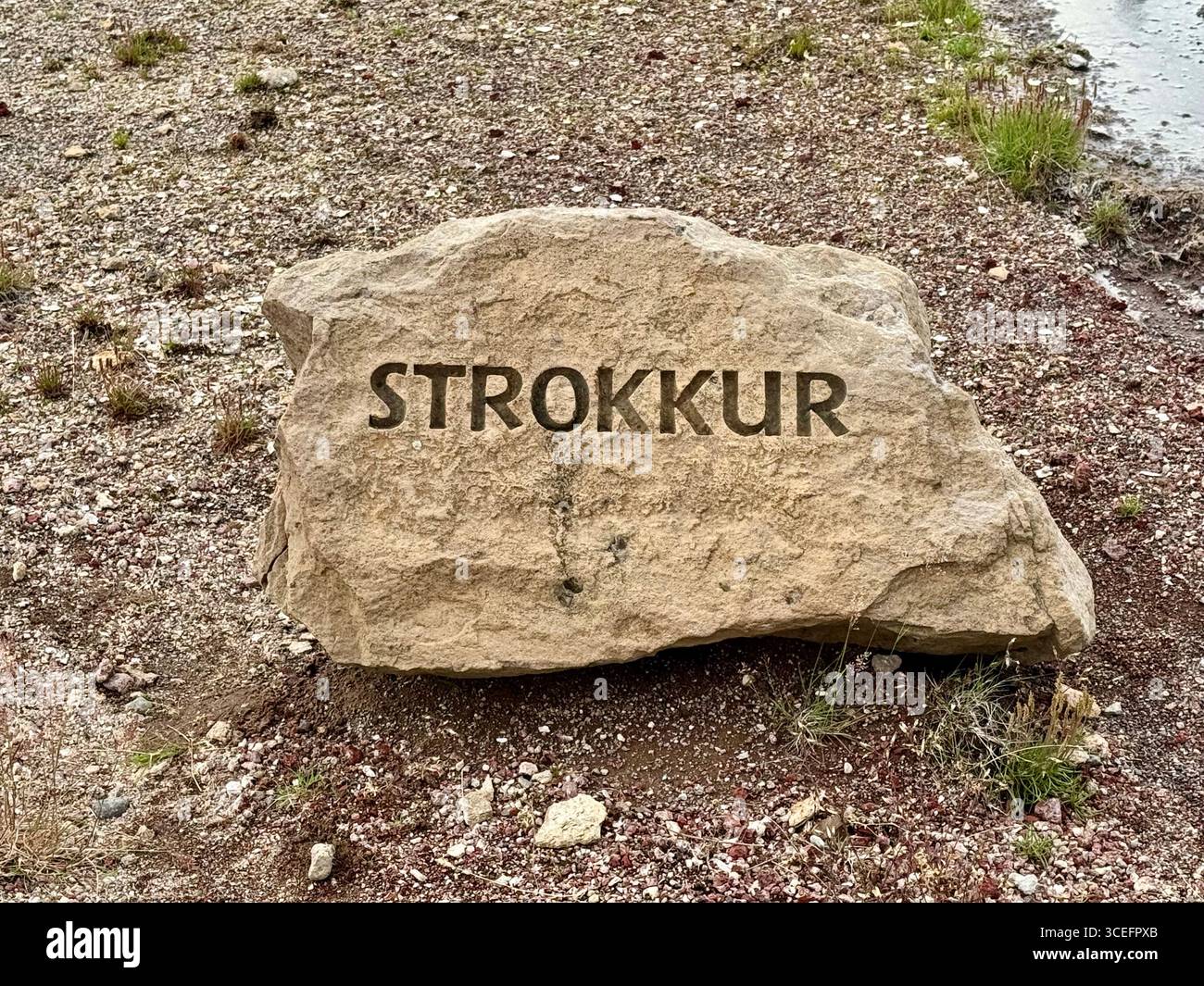 Stone marked at the location of the active Strokkur Geysir in Selfoss, Iceland. - Smartphone Captured Stock Image Stone marked at the location of the active Strokkur Geysir in Selfoss, Iceland. - Smartphone Captured Stock Image