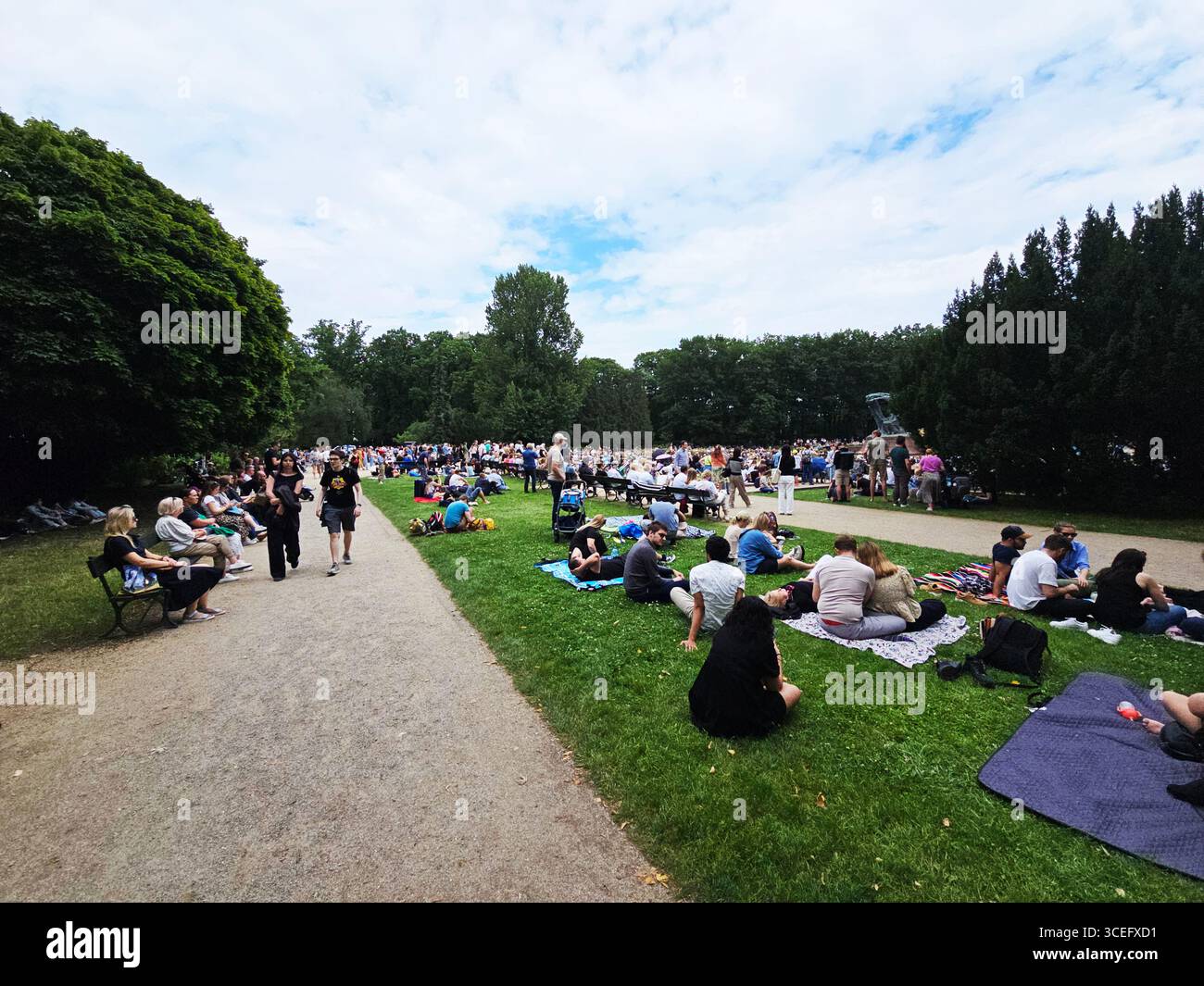 A classical concert by the Fryderyk Chopin Monument at the Royal Baths Park in Warsaw, Poland. - Smartphone Captured Stock Image