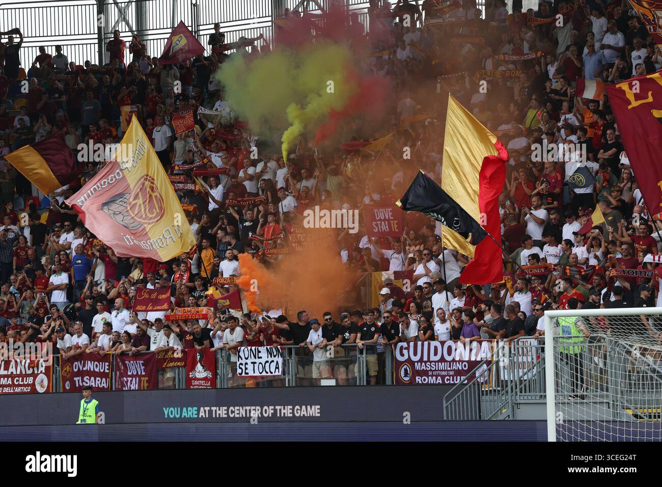 Frosinone, Italy 16 August, 2025: Roma fans waving flags and smoke ...