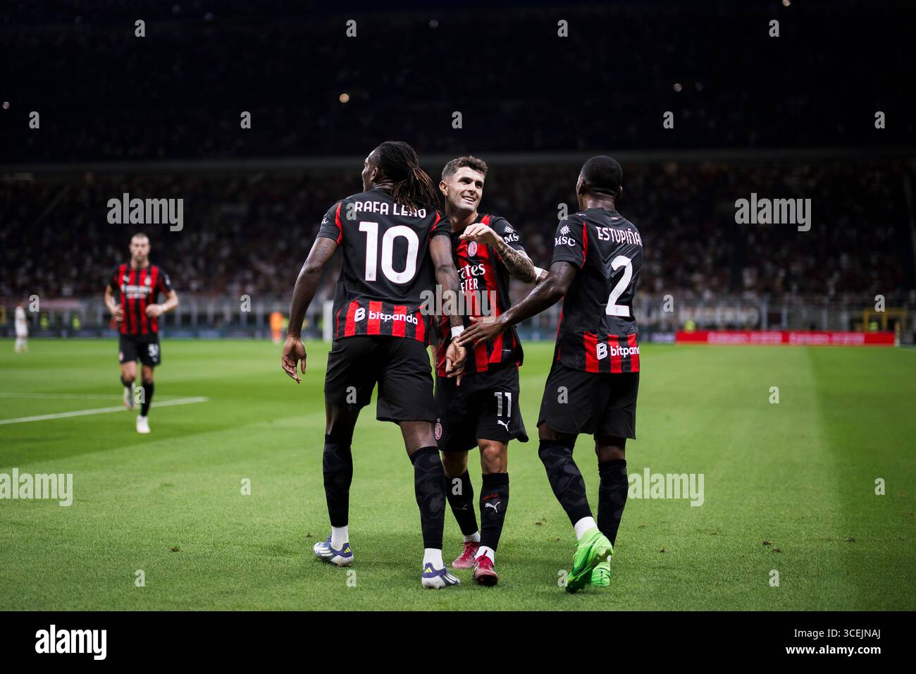 Rafael Leao of AC Milan celebrates with Christian Pulisic and Pervis ...