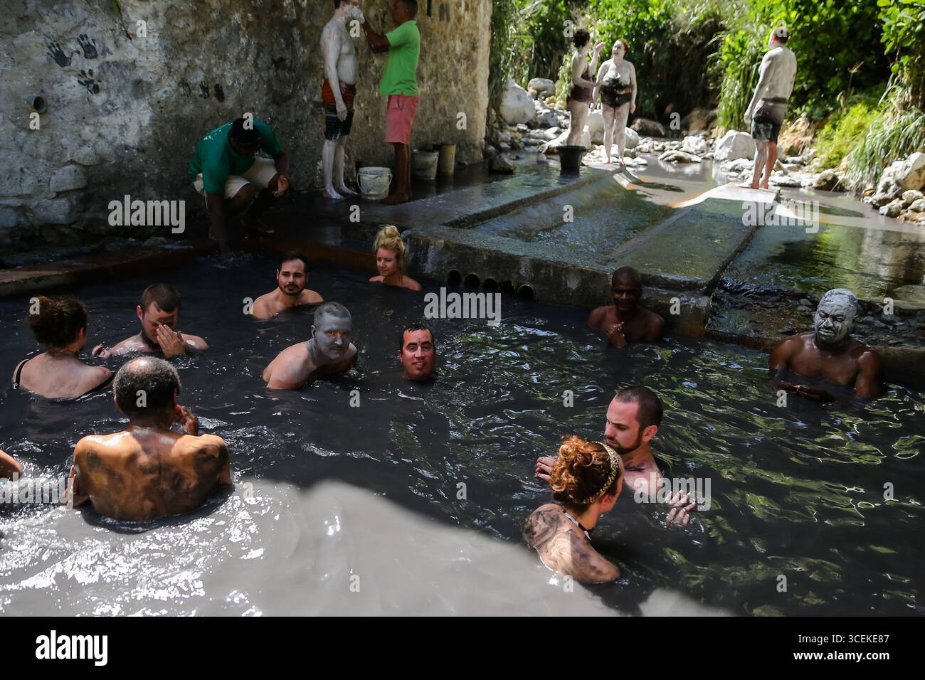 Soufrière, Saint Lucia – December 27, 2015: People enjoying the geothermal sulphur springs and volcanic mud pools at the world’s only drive-in volcano Stock Photo