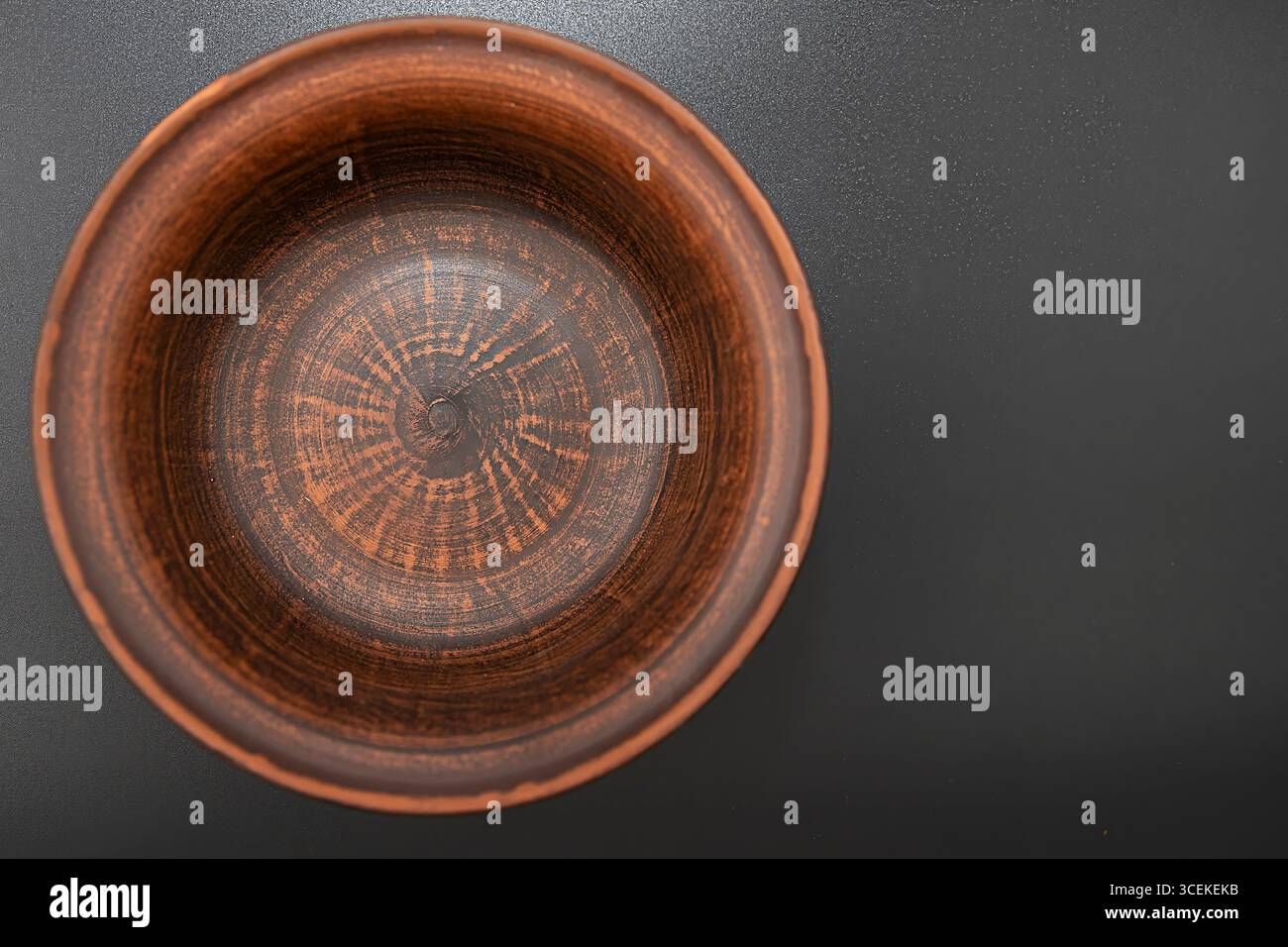 Clay bowl isolated on black background Stock Photo