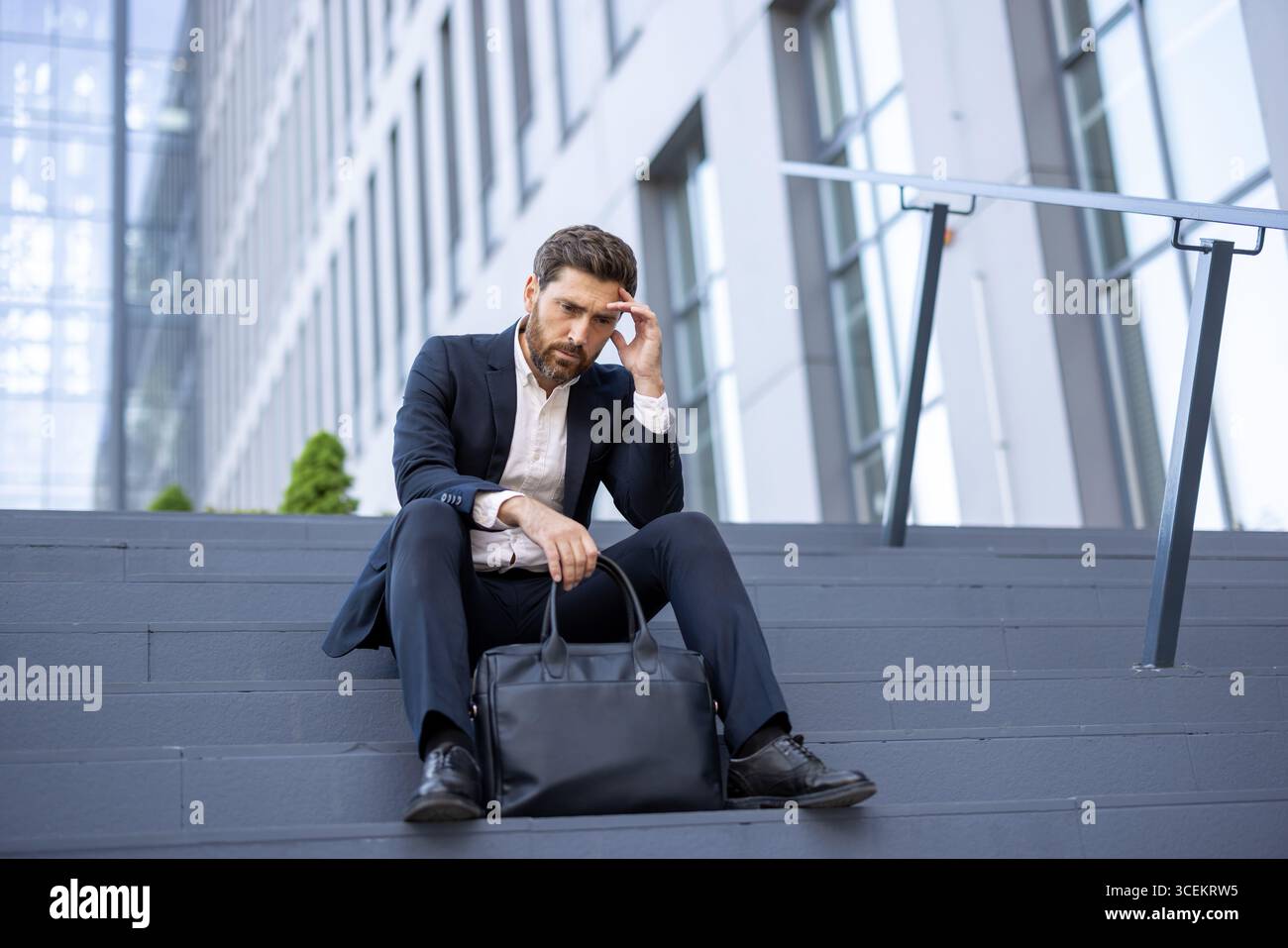Man in formal attire sits thoughtfully hi-res stock photography and ...