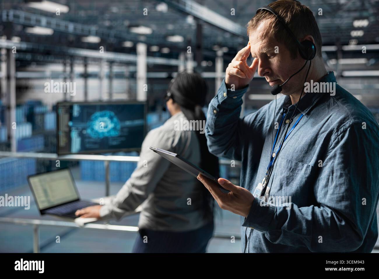 Server hub technicians identifying hardware issues using predictive machine learning alerts, guiding users. Teamworking data center coworkers using headset mic, using AI to resolve clients issues Stock Photo