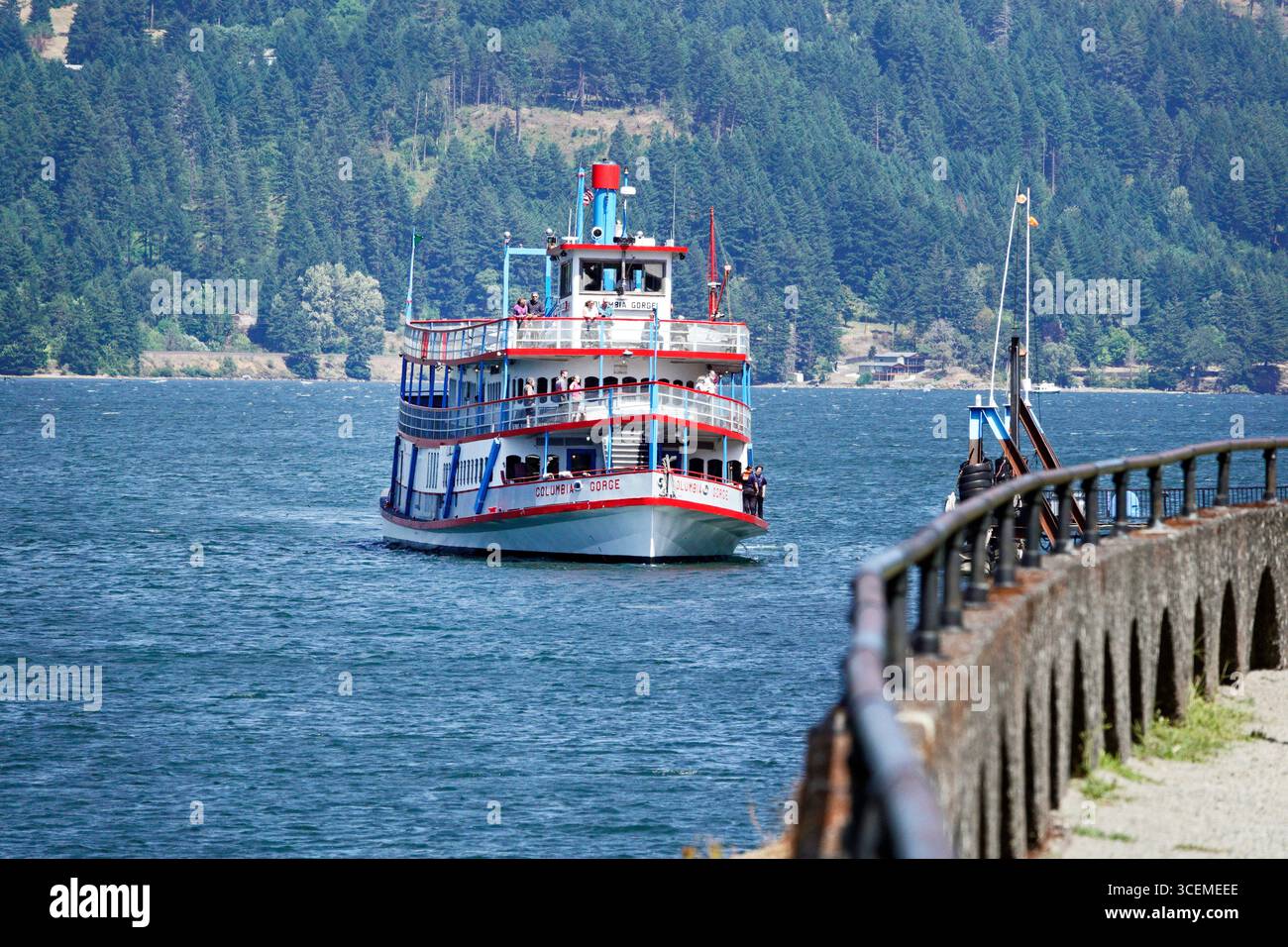A small passenger-carrying steamship paddle-wheeler carries passengers on short tours of the Columbia River Gorge on the Columbia river, Oregon. Stock Photo