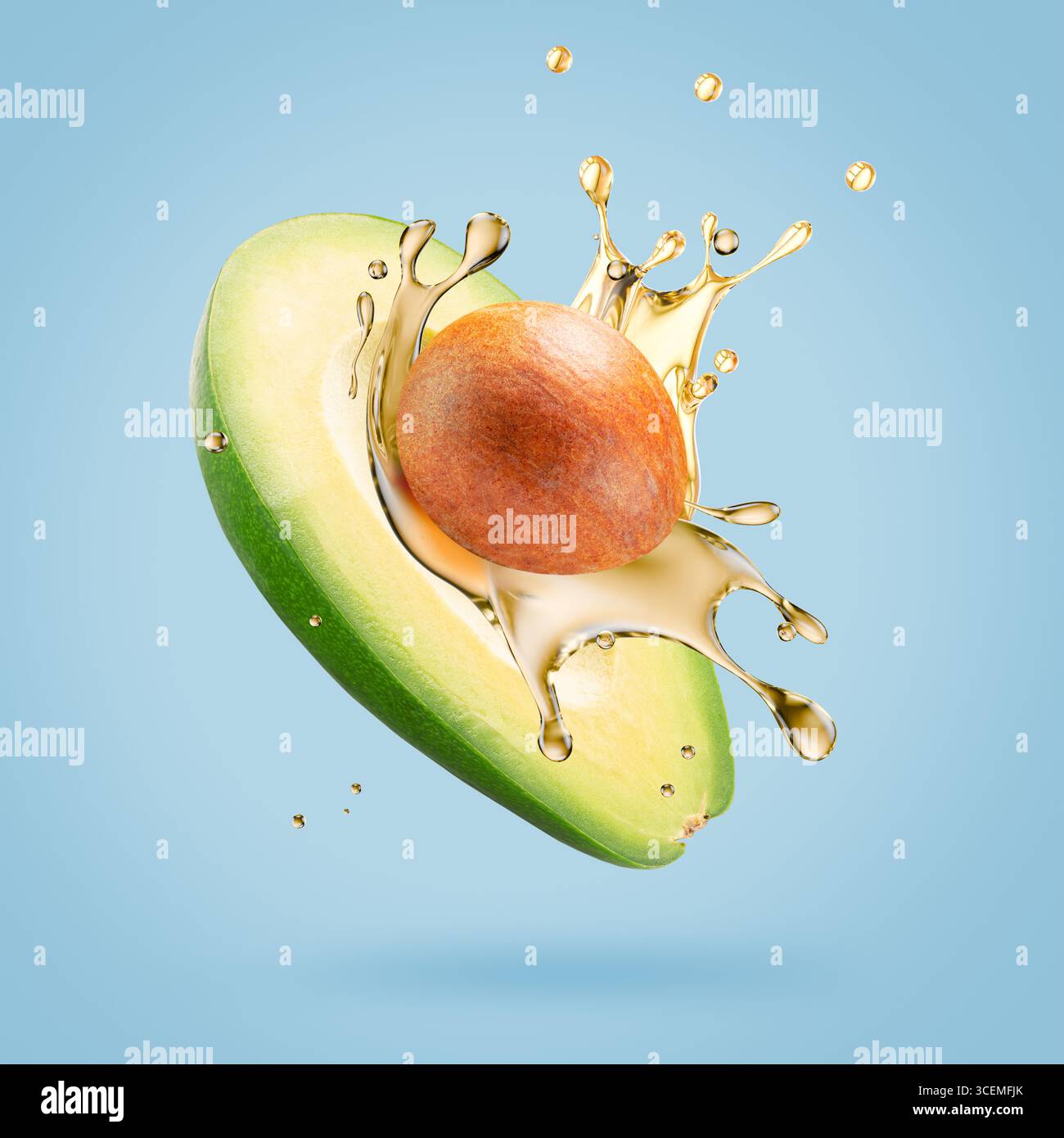avocado with oil splash on a light blue background. Stock Photo