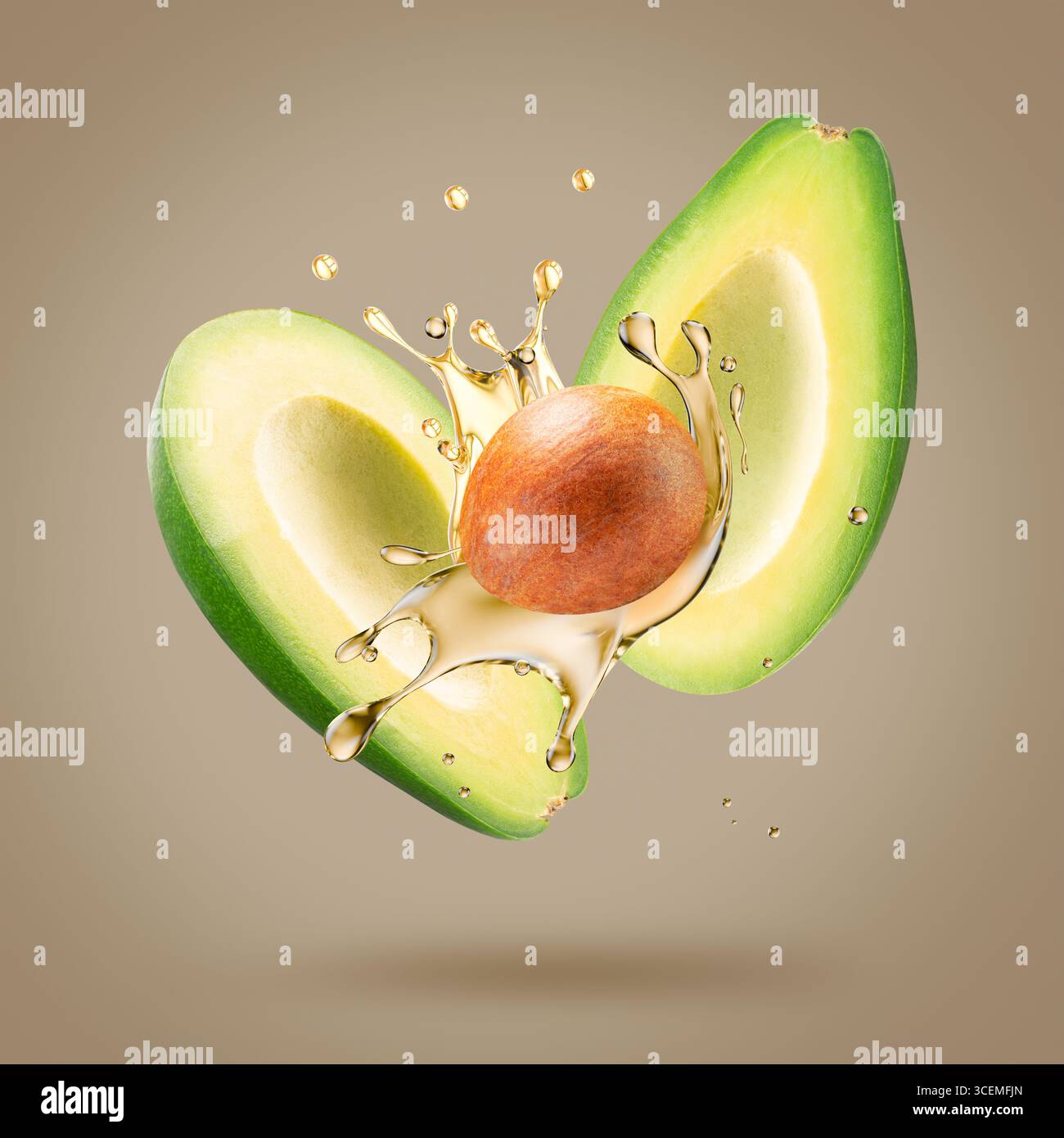 avocado with oil splash on a light brown background. Stock Photo