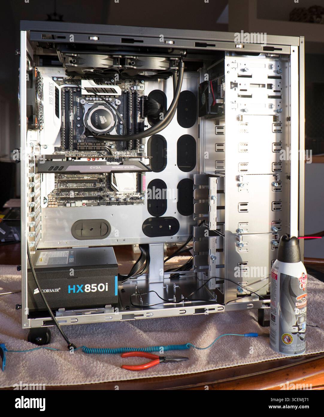 ASUS X99 Deluxe motherboard with liquid CPU cooler installed inside a ...