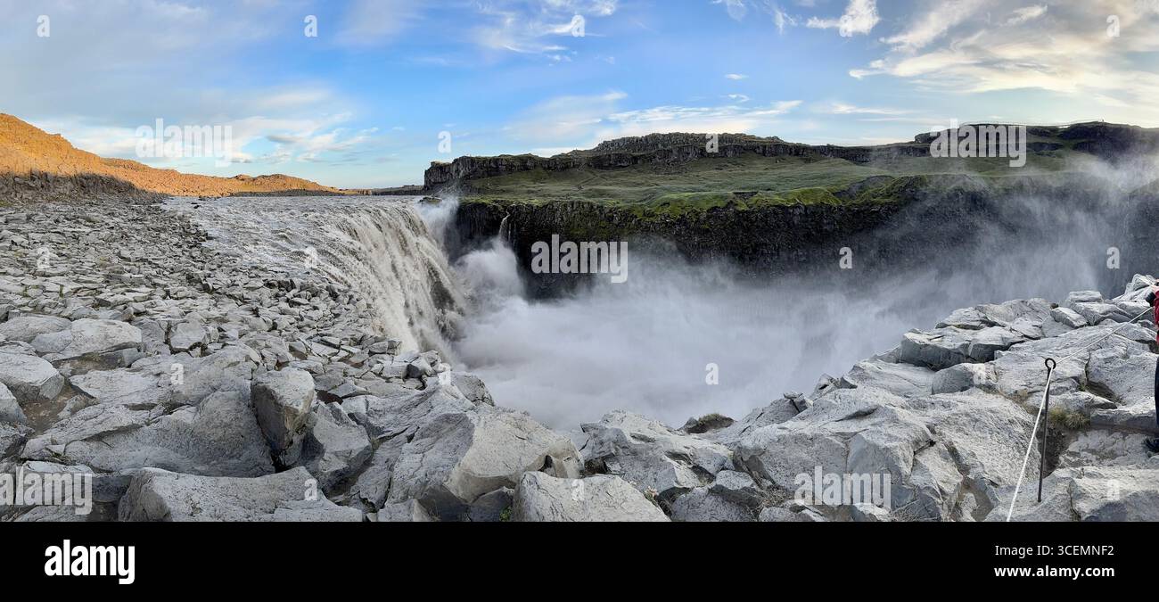 Plumes of mist and spray emerge from the powerful, rushing water of Dettifoss waterfall in northern part of Iceland. - Smartphone Captured Stock Image