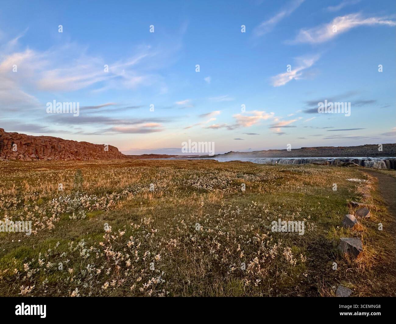 A glimpse of the beautiful Selfoss waterfall can be seen on approach from the hiking trail leading up to it on the east side. - Smartphone Captured Stock Image