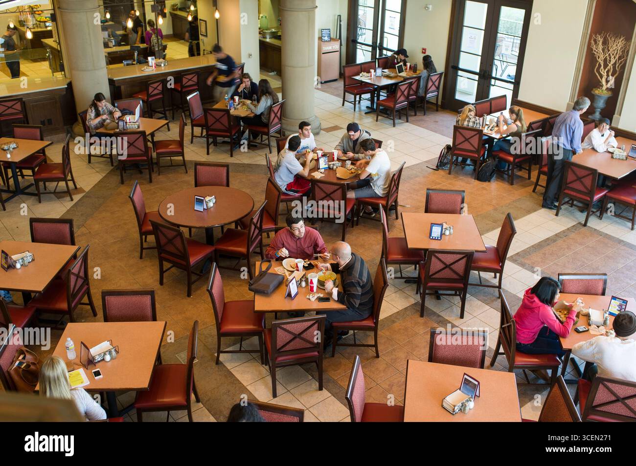 Students eating lunch in Student Life Pavilion at the University of San Diego, San Diego, California, USA Stock Photo