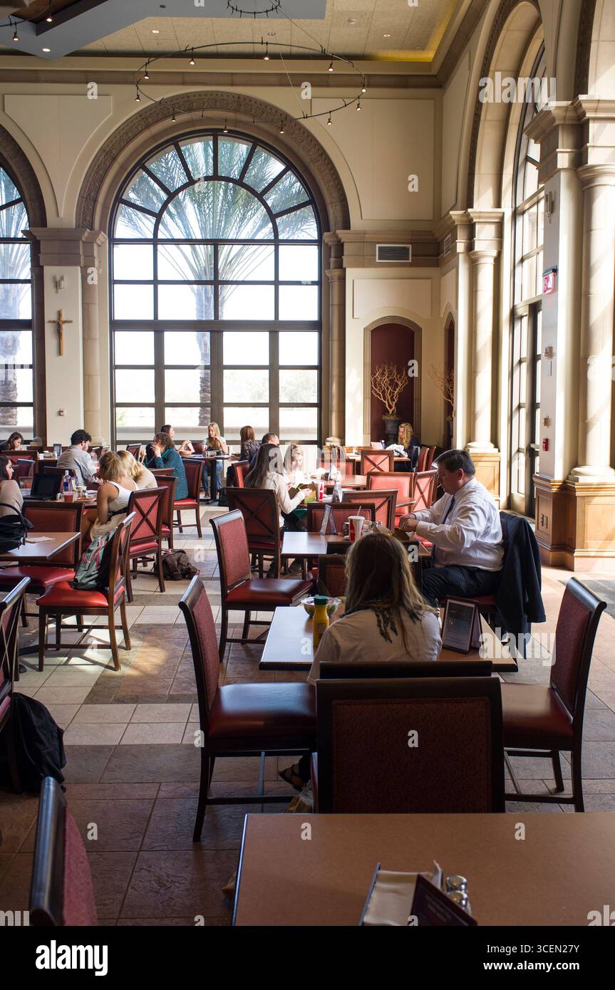 Students eating lunch in Student Life Pavilion at the University of San Diego, San Diego, California, USA Stock Photo