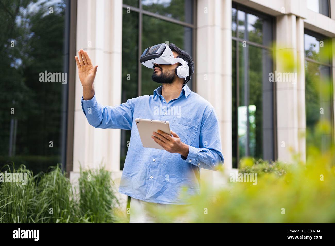 Man Using VR Headset Outdoors Stock Photo