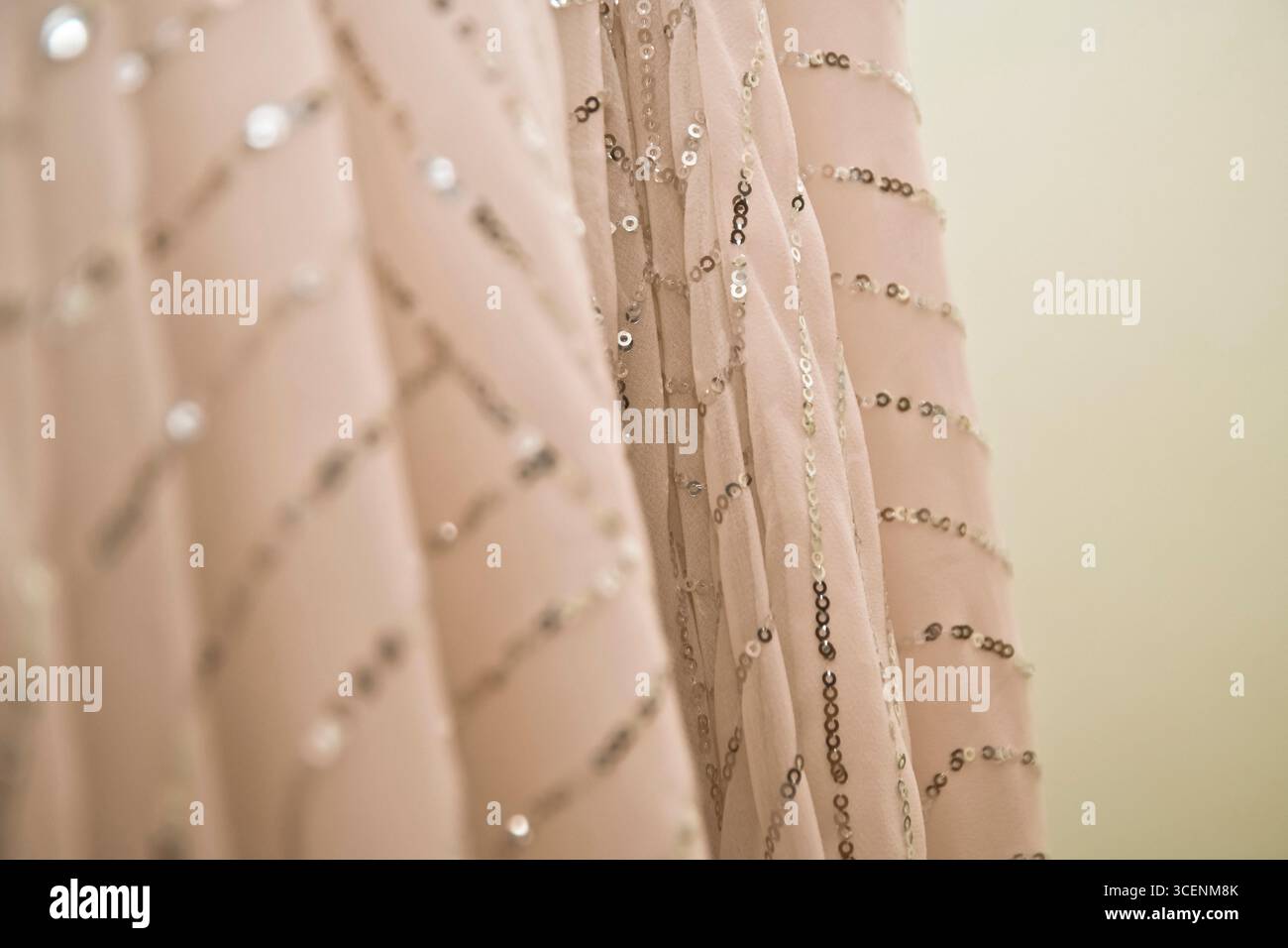 Pink sheer fabric with sequins Stock Photo