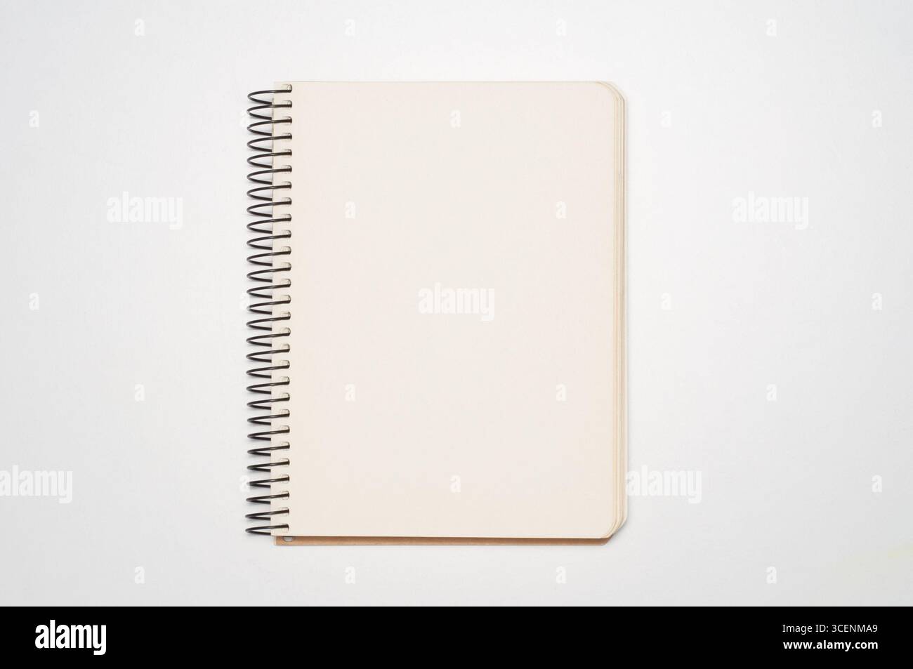 Blank notebook or sketchbook with ring spine on white background Stock Photo