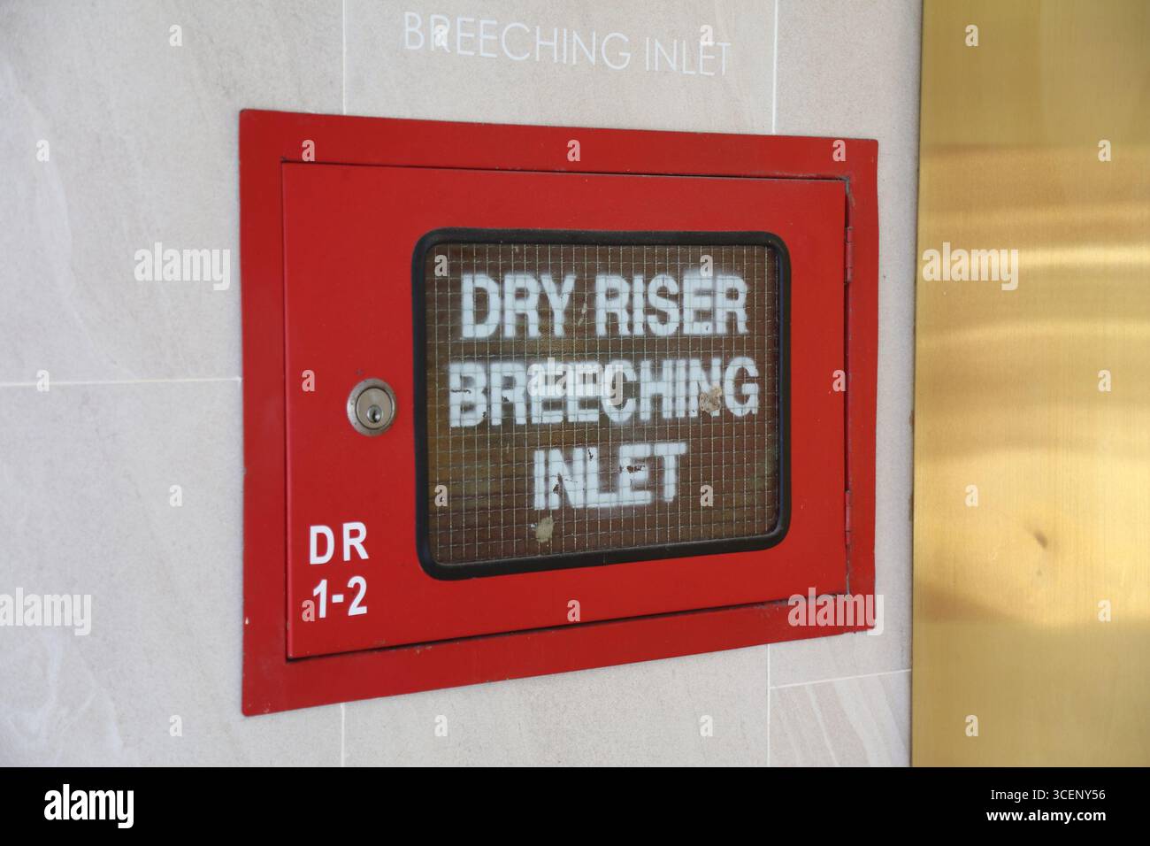 Fire equipment in large building in Singapore City. Dry riser breeching ...