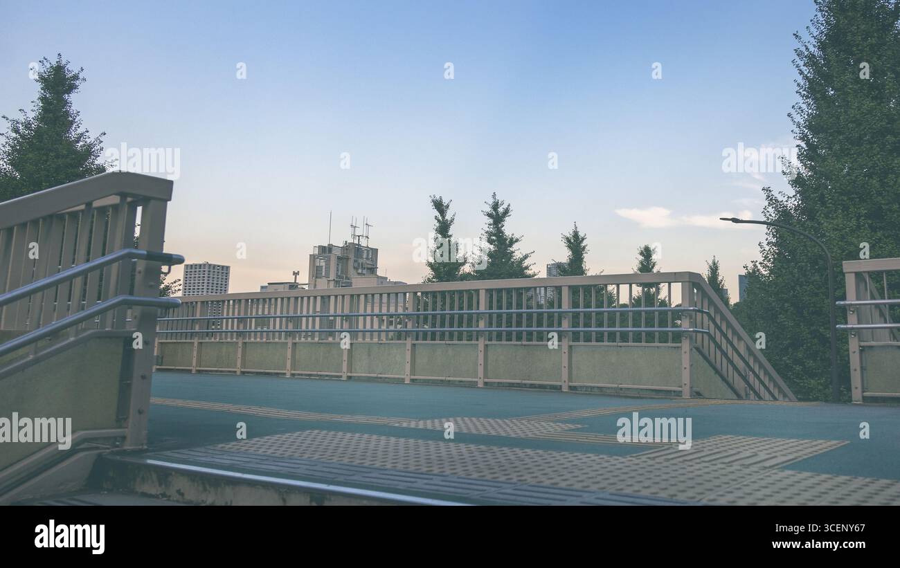 Pedestrian footbridge in Shinjuku, Tokyo, which was the real life location of a scene in 'Your Name'  the animated romantic fantasy film from 2016 - Stock Image