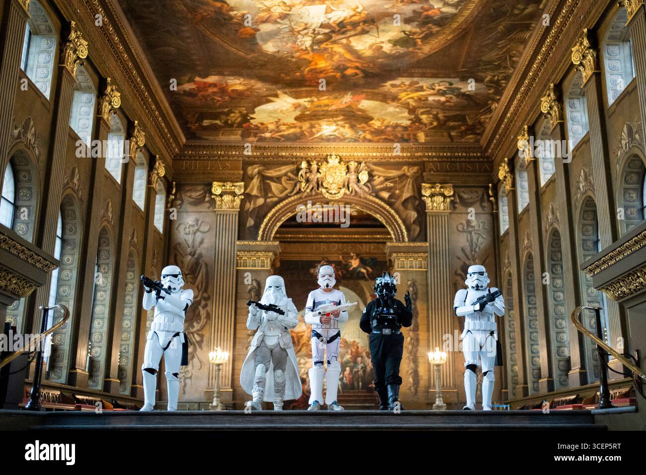 A group of fans dressed as characters from the Star Wars franchise take ...