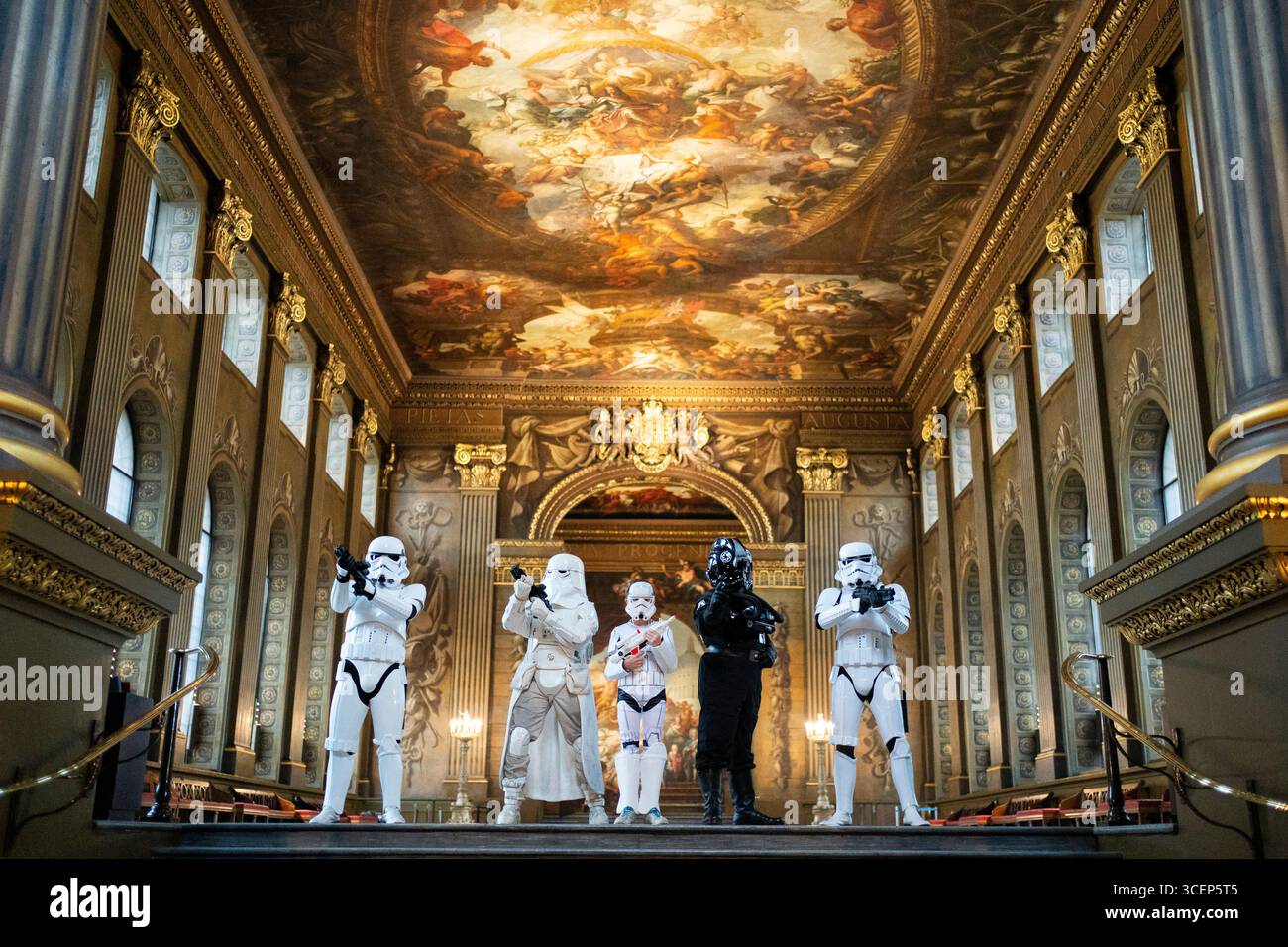 A group of fans dressed as characters from the Star Wars franchise take ...