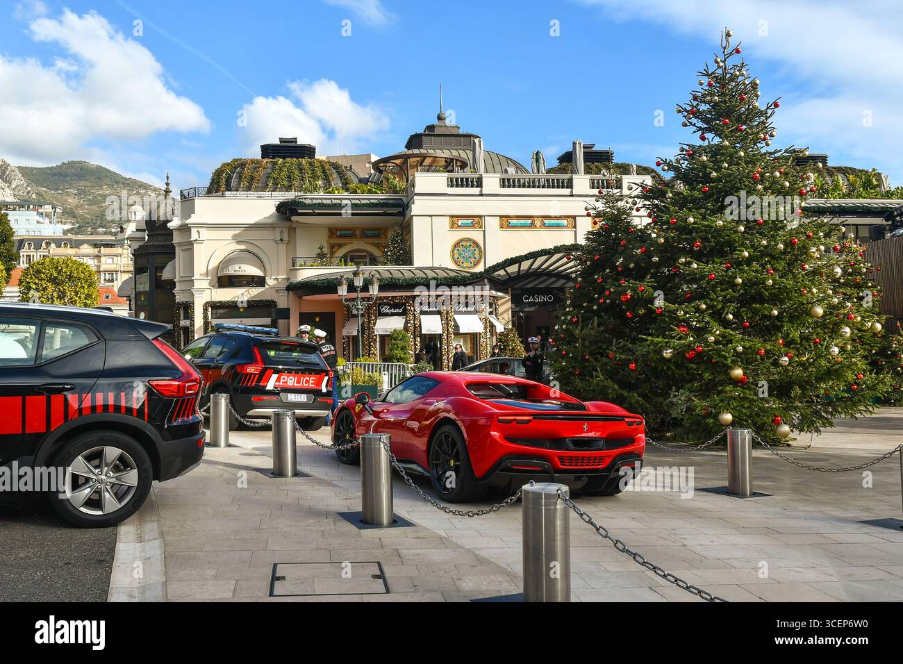 Ferrari Testarossa and police cars in front of Café de Paris Casino, gambling halls with slot machines, in winter, Monaco-Monte Carlo, Monaco Stock Photo