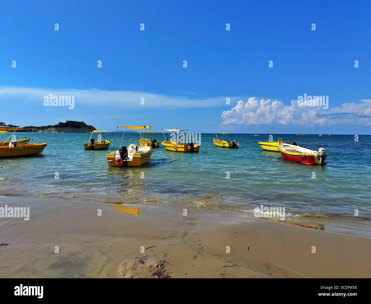 Boats moored at Sidari beach, Northern Corfu, Greece - Smartphone Captured Stock Image