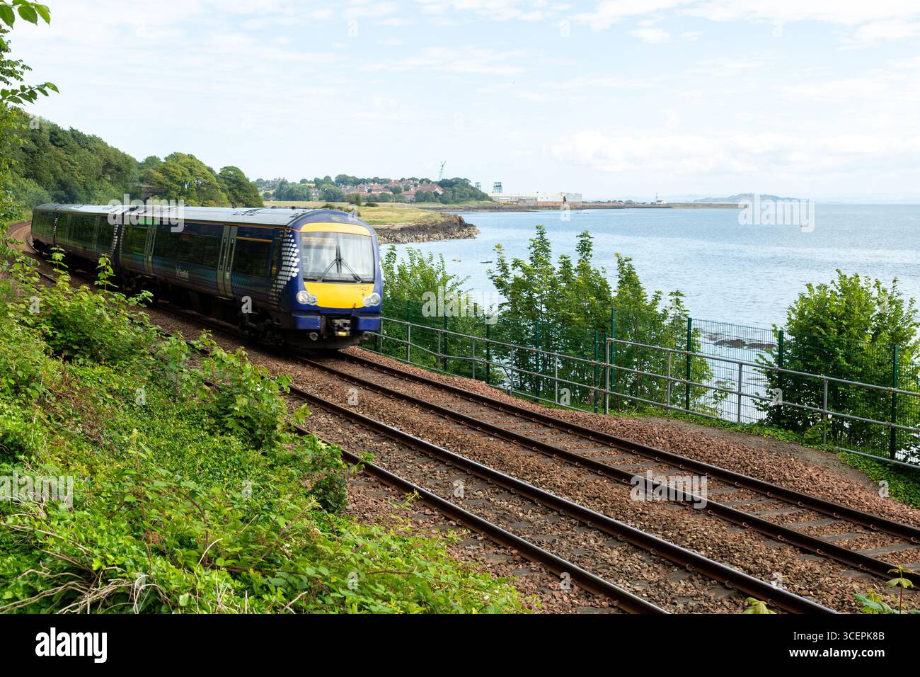 A scotrail train on the scenic coastal railway along the Fife Coast between Burntisland and Aberdour, Scotland Stock Photo