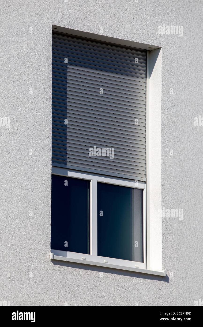 Electric roller shutter on a new residential building Stock Photo