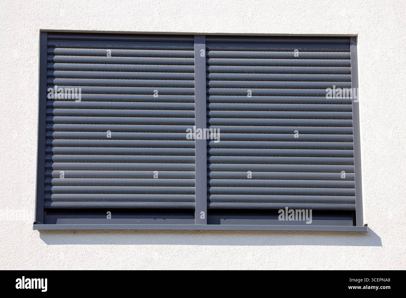 Electric roller shutter on a new residential building Stock Photo