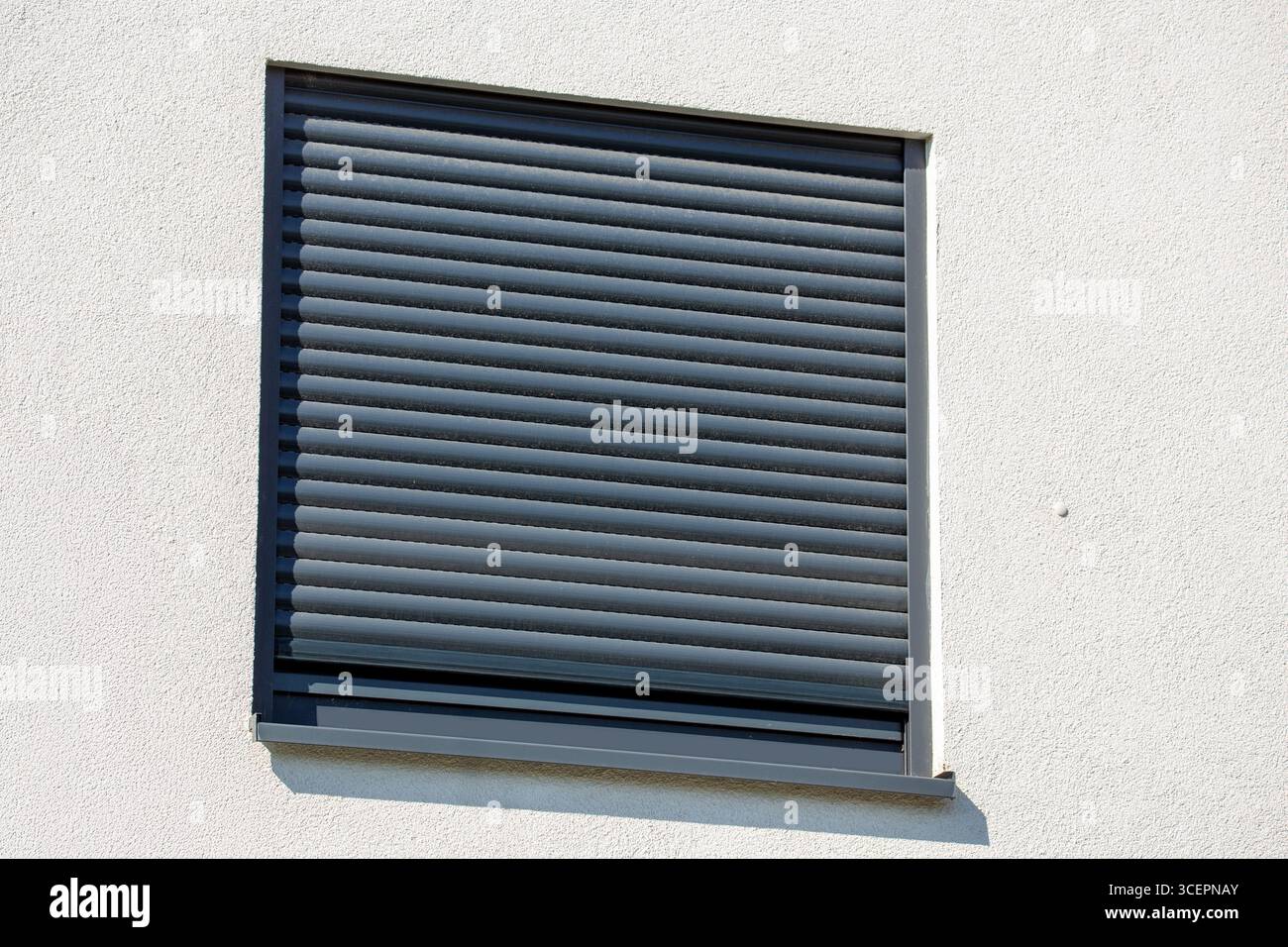 Electric roller shutter on a new residential building Stock Photo