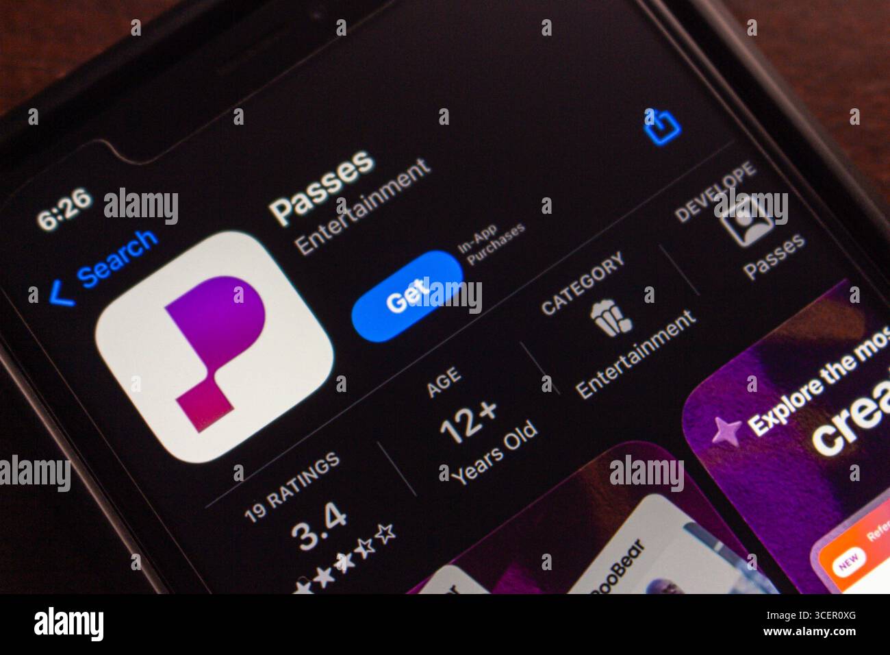 Close-up of a smartphone showing the Passes app on an app store ...