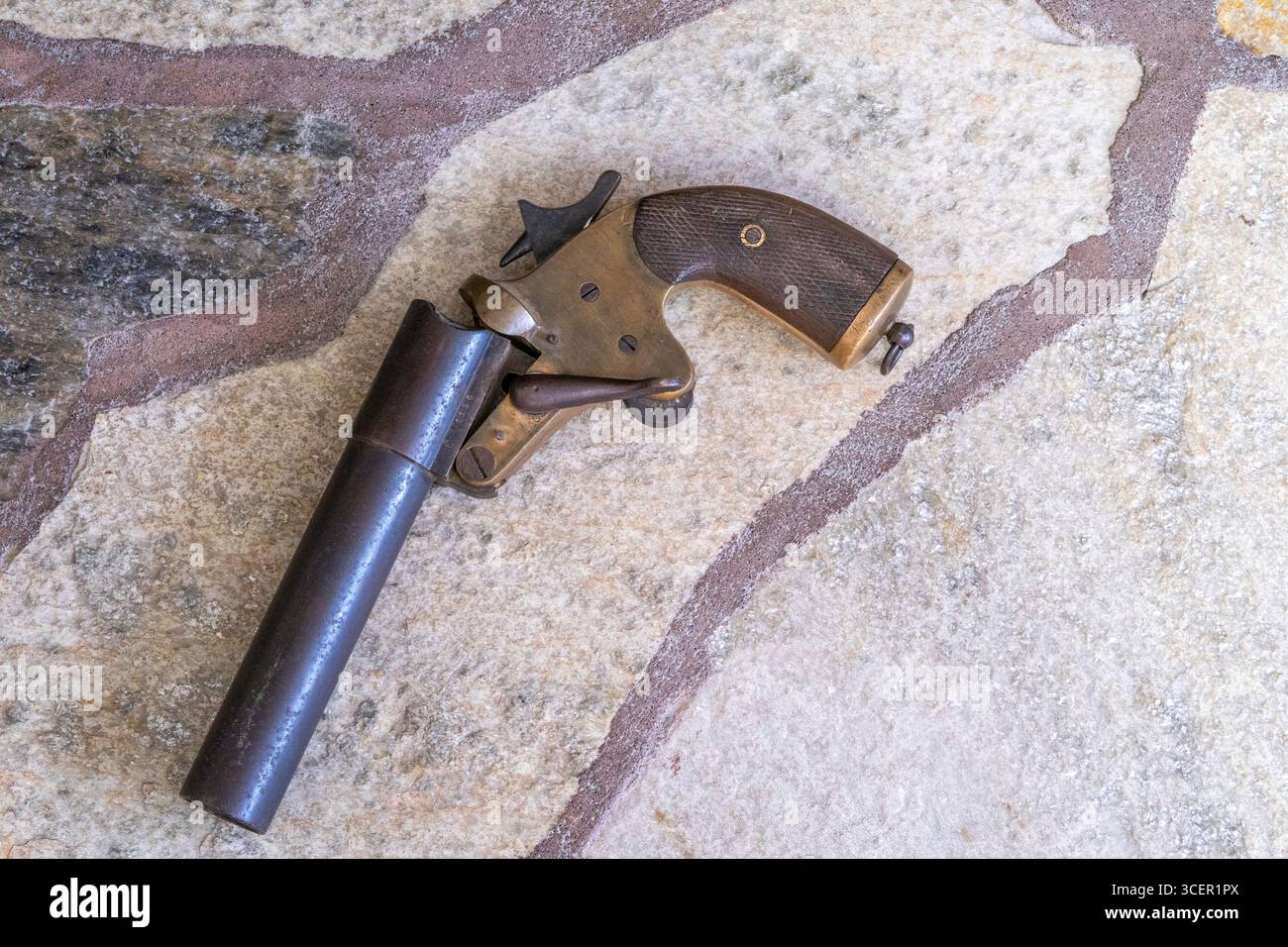 Still of WW2 Flare Pistol on a Stone Slate Floor, 2025, USA Stock Photo