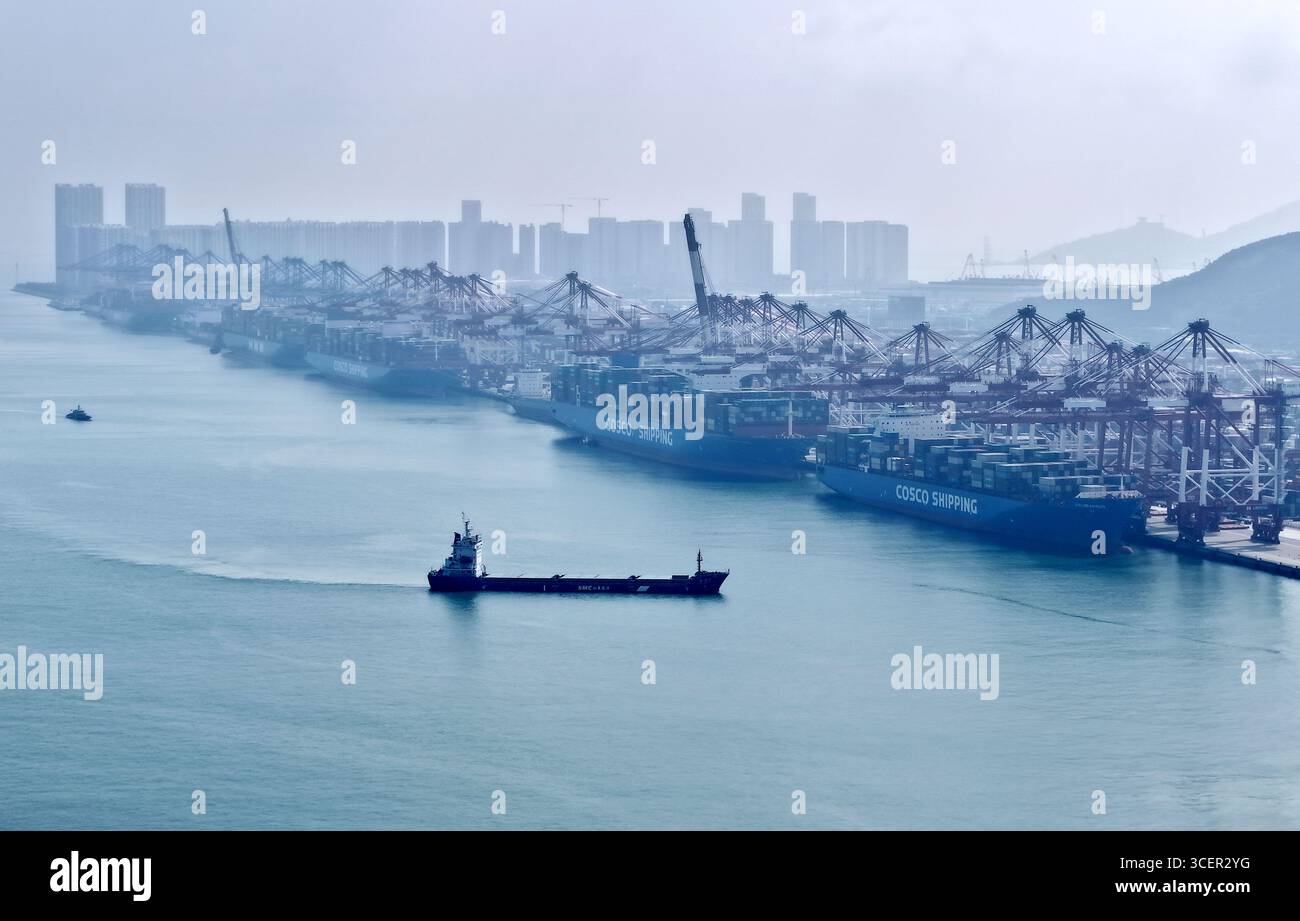 Qingdao. 19th Aug, 2025. An aerial drone photo taken on Aug. 19, 2025 shows a cargo ship navigating at Qingdao Port in Qingdao, east China's Shandong Province. As of the end of July, Qingdao Port has added 22 new outbound trade routes this year, bringing its total to 233 and connecting to over 700 ports in more than 180 countries and regions. Credit: Li Ziheng/Xinhua/Alamy Live News Stock Photo