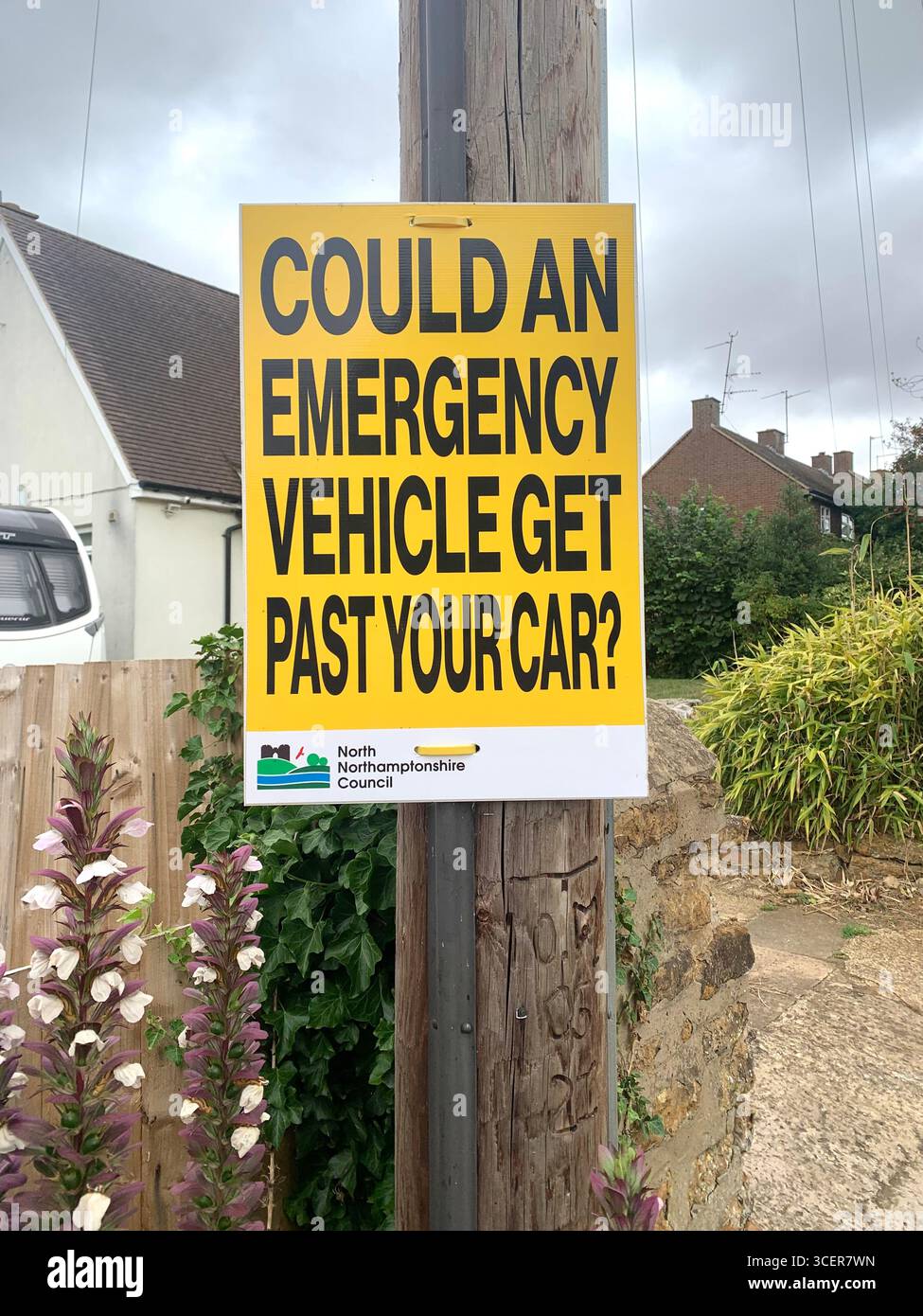 information board sign signs Could an  Emergency Vehicle get past your vehicle Ambulance Fire Police car cars waiting to cross go past urgent help - Smartphone Captured Stock Image