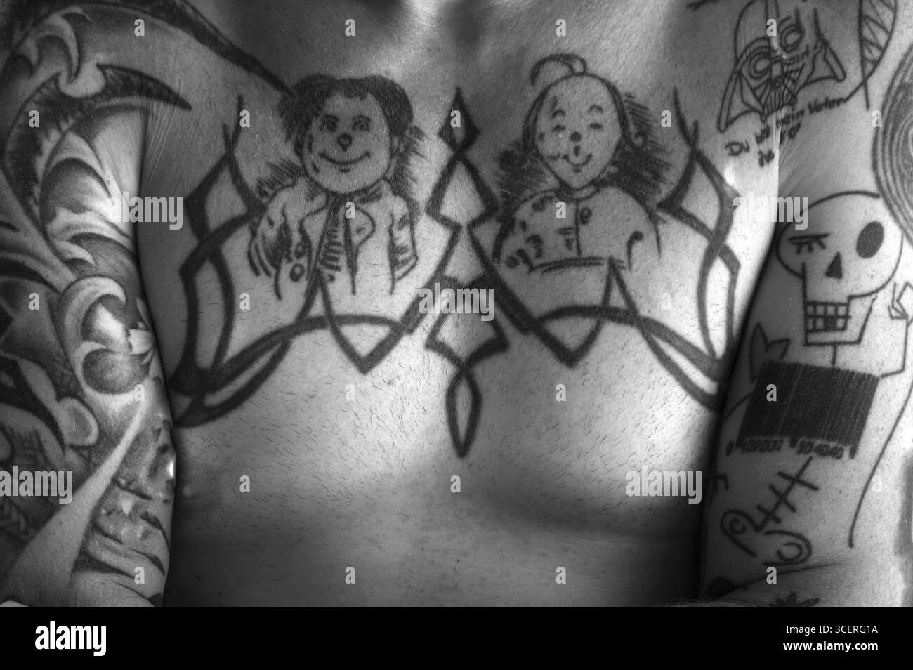 Tattoos Max and Moritz on the chest of a young man, black and white, Baden-Wuerttemberg, Germany Stock Photo