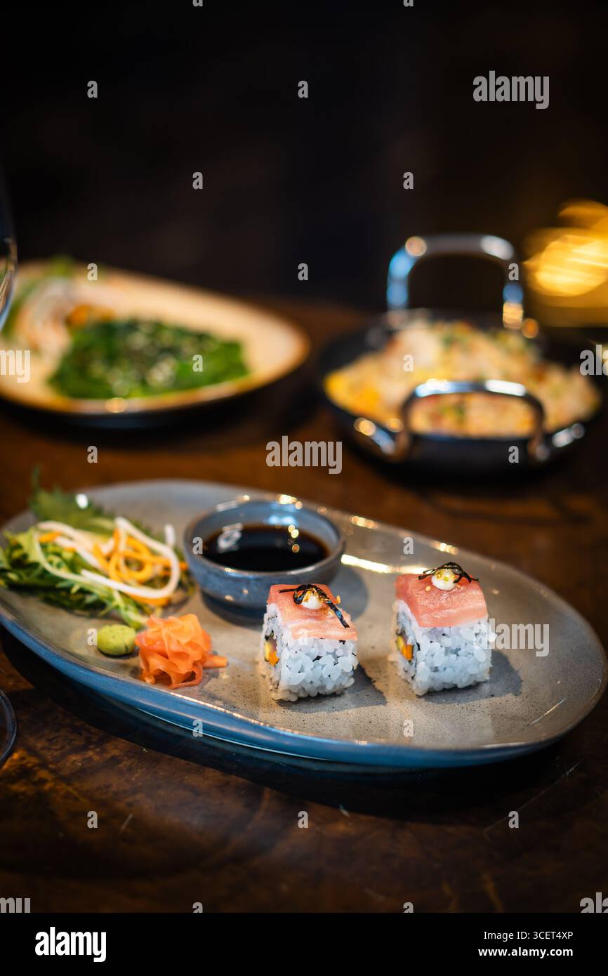 Fresh Sushi Rolls with Salmon and Tuna, Japanese Cuisine on a Gourmet Seafood Plate Stock Photo