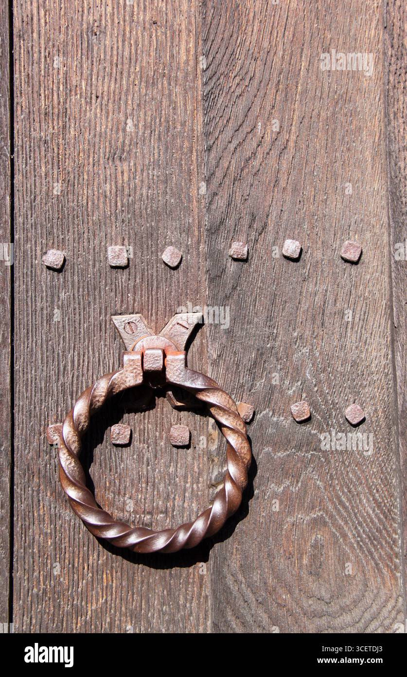 Door detail of The Crooked House in Lavenham, UK, built in 1395 and said to have inspired the traditional nursery rhyme 'There was a Crooked Man'. Stock Photo