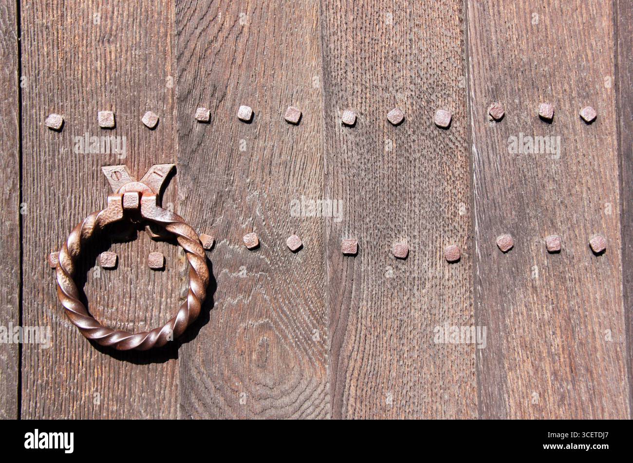 Door detail of The Crooked House in Lavenham, UK, built in 1395 and said to have inspired the traditional nursery rhyme 'There was a Crooked Man'. Stock Photo