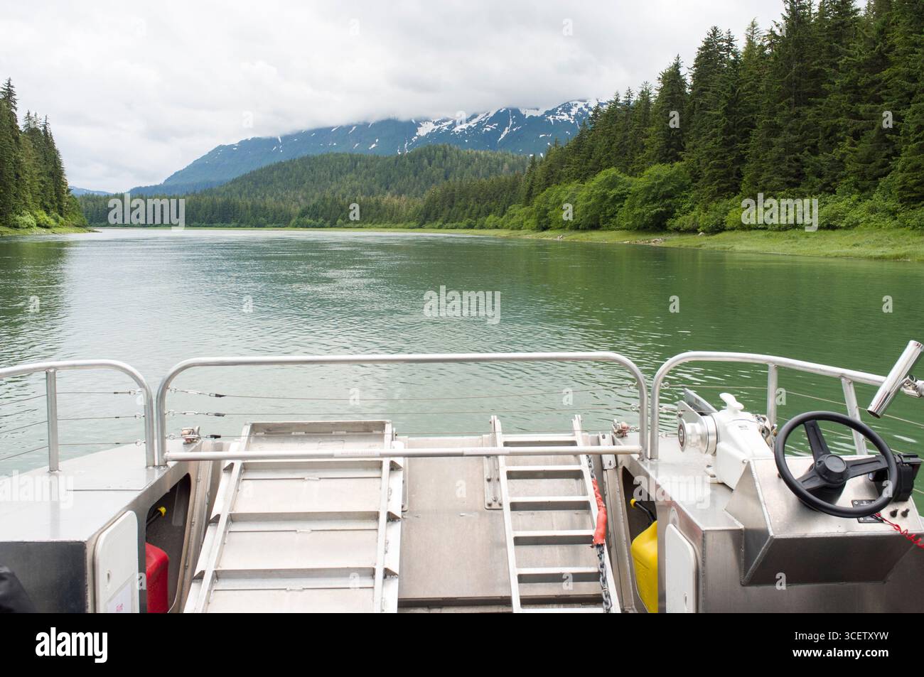 Aluminum boat WEATHER PERMITTING ALASKA heading south into Oliver Inlet ...