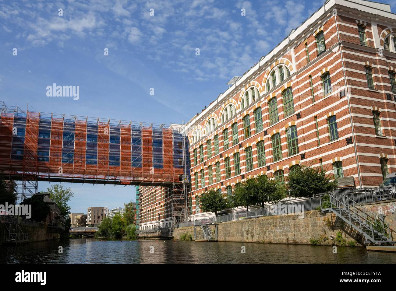The Renovated Buildings Of The Buntgarnfabrik On The Weiße Elster In Leipzig. It Is A Striking Example Of Late 19th Century Industrial Architecture In Stock Photo