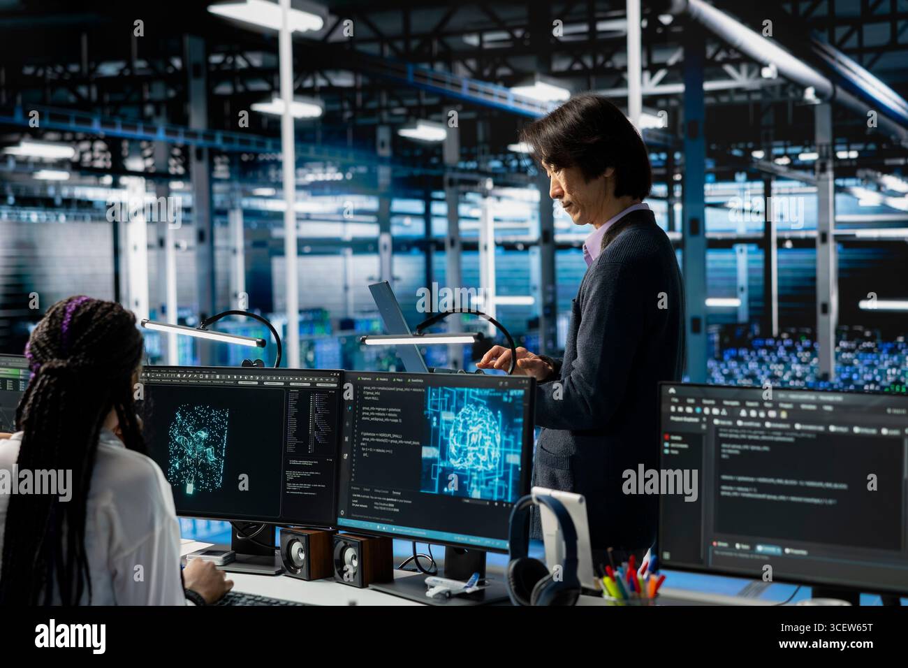 Data center developer monitoring AI systems, adjusting machine learning parameters. Server hub IT employee in office enhancing artificial intelligence software performance Stock Photo