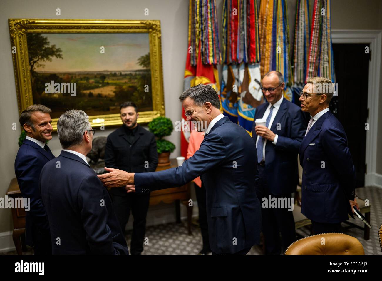 Washington, United States. 18th Aug, 2025. French President Emmanuel Macron, U.K. Prime Minister Keir Starmer, Ukrainian President Volodymyr Zelenskyy, European Commission President Ursula von der Leyen, NATO Secretary General Mark Rutte, German Chancellor Friedrich Merz, and Finnish President Alexander Stubb wait in the Roosevelt Room as President Donald Trump makes a call with Russian President Vladimir Putin in the Oval Office, Monday, August 18, 2025. Photo by Daniel Torok/White House/UPI Credit: UPI/Alamy Live News Stock Photo