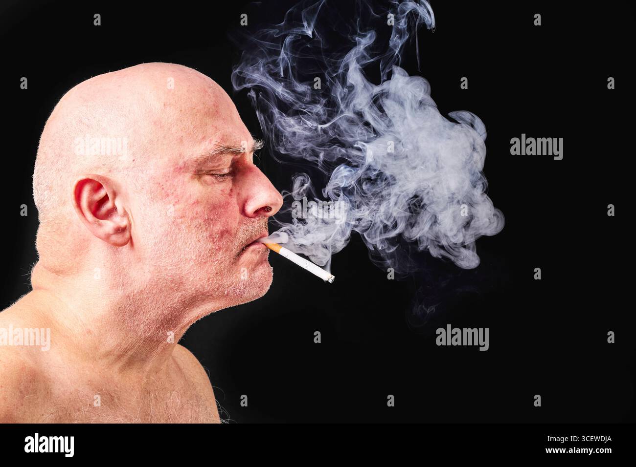 cigarette puffing Portrait young man smoking cigarette hi-res stock photography and images