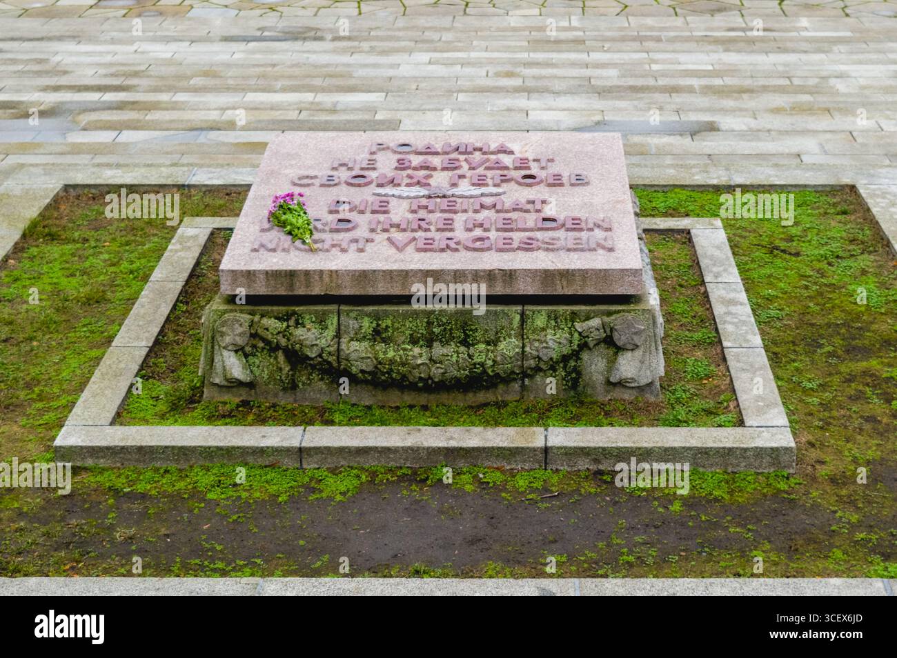 Stone plaque memorial at Treptower Park in Berlin, Germany, inscribed in Russian and German to honor fallen World War II heroes. Stock Photo